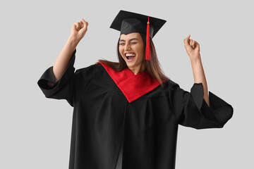 Sticker - Happy female graduate student on light background