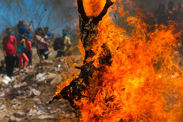 Burning of masks on Saturday of glory of Holy Week celebrated by the Yaqui community or tribe in Hermosillo Mexico on April 15, 2017. masks with strange shapes or demons burn the flames or fire.