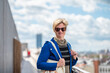 © Werner - Portrait of a 37 yo white woman with the city in the background, Belgium