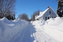 Snowy Driveway With Cleared Path And Piled Snow