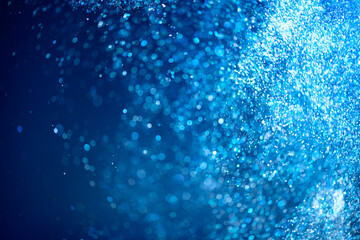Wall Mural - abstract blue background with floating particles, glowing backdrop. glitter blinking sparks backgrou