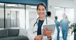© SneakyPeakPoints/peopleimages.com - Happy woman or doctor face in busy hospital with tablet for healthcare services, leadership and career mindset. Portrait of medical professional or female on telehealth app for clinic job management