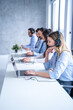 © Bojan - Smiling blond haired customer support agent woman listening attentively to the client's inquiries, demonstrating her dedication to providing top-notch service.