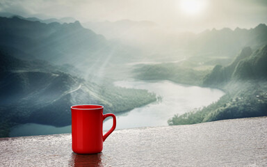 Wall Mural - freshly brewed coffee or espresso into a red cup and coffee mug. Hot coffee in a mug placed on the tabletop or wooden balcony. Morning mountain view, morning sunshine. 3D Rendering