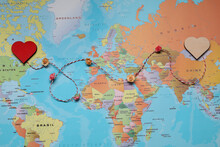Decorative Cord With Hearts On World Map Symbolizing Connection In Long-distance Relationship, Top View