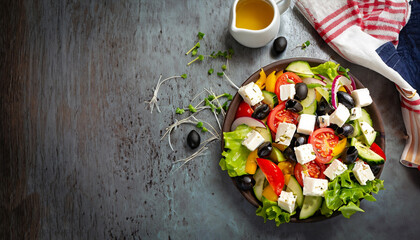 Greek salad with fresh vegetables, feta cheese and black olives. Top view