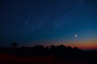 Leinwandbild Motiv Crescent Moon, falling star, planet conjunction and landscape scenery silhouettes.