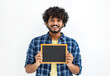 © kucherav - Happy Asian man with curly hair holds a small empty chalkboard looks at the camera and smiles friendly standing on a white background