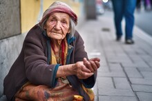 Elderly Woman Begging For Money On Street