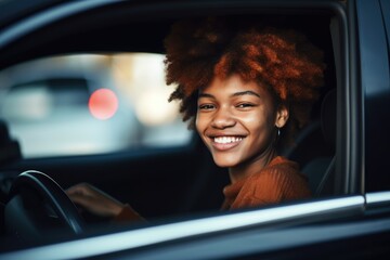 Wall Mural - shot of a smiling young woman sitting in the front seat of a car