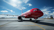Flughafenleben: Rotes Verkehrsflugzeug vor dem Abflug