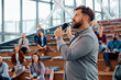 © Drazen - Entrepreneur giving speech during business seminar at conference hall.