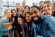 © Drazen - Large group of happy entrepreneurs taking selfie while attending business conference at convection center.