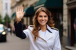 Happy servicewoman waving her hand on her homecoming