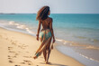 © wolfhound911 - Attractive african woman in bikini walking on the beach