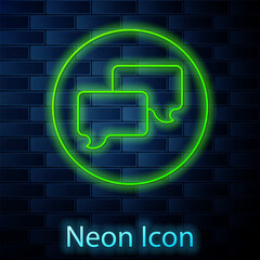 Wall Mural - Glowing neon line Speech bubble chat icon isolated on brick wall background. Message icon. Communication or comment chat symbol. Vector