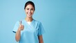 © HN Works - A cheerful nurse with clipboard on blue background
