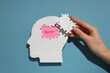 © Atlas - Paper human head with the word 'bipolar', bipolar disorder concept