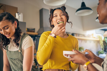 Wall Mural - Women, friends and eating healthy food in home for bonding, nutrition and happy lunch together. Fruit diet, sharing and wellness, fresh summer friendship and girls in kitchen with smile at party.
