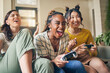 Friends, women and gaming on tv, winner in home living room on sofa and smile, relax and bonding. Television, girls and celebration on video game success on couch, esports competition and excited
