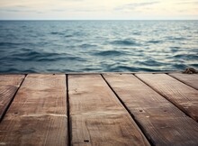 Wooden Deck Waterfront Sea Shoreline Background Texture And Water Surface With Small Waves With Horizon Line, Wallpaper Pattern, Copy Space Created With Generative AI Technology.