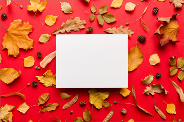 Wall Mural - autumn composition with paper blank and dried leaves on table. flat lay, top view, copy space