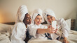 © Davids C/peopleimages.com - Spa day, selfie and friends in bed relax with social media during skincare routine at home. Bedroom, self care and women beauty influencer with smartphone smile for profile picture, blog or podcast
