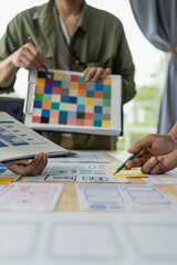 Wall Mural - the web ux ui design team is writing code and layers to customize the smartphone front ux ui display