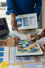 Wall Mural - the web ux ui design team is writing code and layers to customize the smartphone front ux ui display