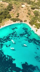 Wall Mural - Aerial vertical shot of crystal water sea lagoon with yachts on Aegean sea in Bodrum, Turkey