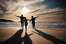 Family, Running And Silhouette On Beach With Sunset, Freedom And Fun Together, Games And Bonding On Vacation. Travel, Adventure And Playful, Parents And Child With Happy People In Nature And Energy