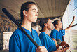 © Mumtaaz Dharsey/peopleimages.com - Women, team and softball, sports and game with fitness, professional and athlete group together. Mission. confidence and support, trust and exercise, people ready to play baseball and club in dugout