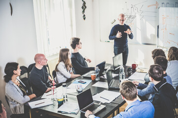 Wall Mural - relaxed informal it business startup company meeting. team leader discussing and brainstorming new a