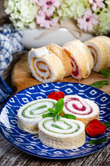 Wall Mural - Slices of homemade sweet roll with fruit jam.