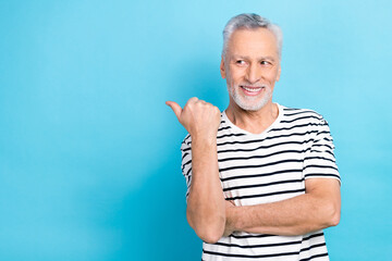 Wall Mural - Photo portrait of funny old male look point empty space promotion dressed stylish striped garment isolated on blue color background