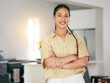 © Davids C/peopleimages.com - Portrait, smile and arms crossed with a woman in her apartment as a proud homeowner or tenant. Brazil, relax and satisfaction with a happy young female person in the kitchen of her modern house