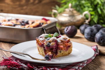 Wall Mural - Yeast cake with plums and blueberries.