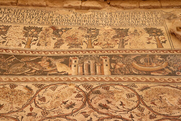 Wall Mural - An ancient, archeological mosaic inscription from the Roman era, located in the Jordanian Arab governorate of Madaba in the Middle East