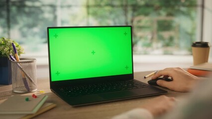 Anonymous Creative Project Manager Working on a Laptop Computer with Mock Up Green Screen Chromakey Display with Motion Tracker Placeholders. Video Template for Content Creation and Presentation