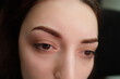 Girl model after the procedure of permanent make-up of eyebrows. Eyebrow permanent makeup cosmetic procedure.