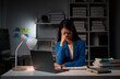 © PaeGAG - Tired Asian businesswoman working part time in office office alone