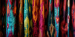 Abstract background of hand-dyed ikat fabric. A vibrant and colorful textile design.