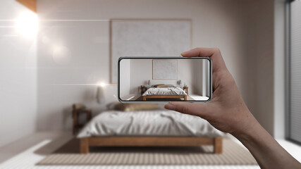 Wall Mural - hand holding smart phone, ar application, simulate furniture and interior design products in real ho