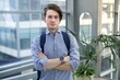 © Евгений Шемякин - Portrait of young businessman, office worker or college or university student in shirt and jacket, suit looking at camera indoors