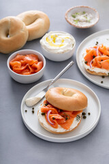 Wall Mural - Plain bagel with salmon and cream cheese with fresh dill and capers