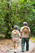 © CandyRetriever  - Asian senior couple relax and enjoy outdoor lifestyle travel nature hiking together at tropical forest trail on summer vacation. Retired elderly people leisure activity and mental health care concept.