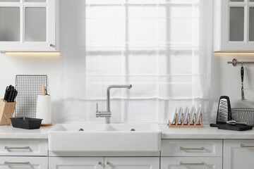 Poster - Set of different utensils near sink on countertop in kitchen