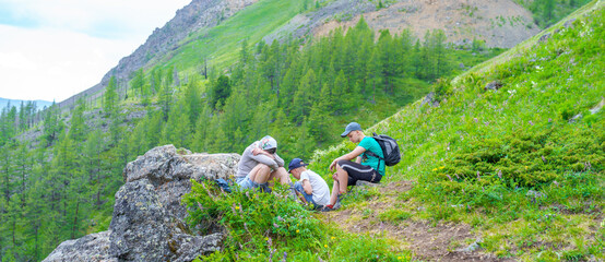 Wall Mural - People sitting on the hill 