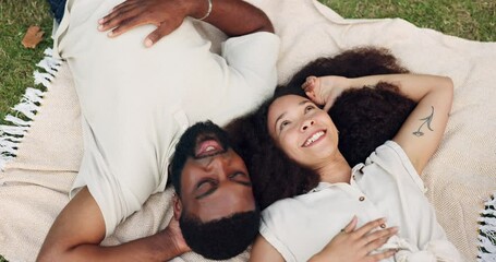 Canvas Print - Top view, happy and couple on picnic blanket, talking or bonding together in nature. Love, interracial and man and woman on the ground to relax outdoor for conversation, smile or romance at park date