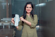 Indian woman showing sanitary pad at hospital